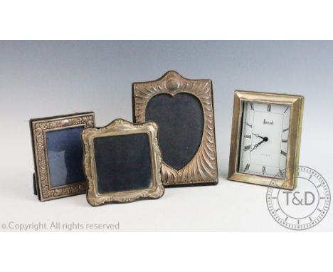 A silver heart shaped photograph frame, Keyford Frames Ltd, London 1986, 19.5cm high with a silver rectangular photograph fra