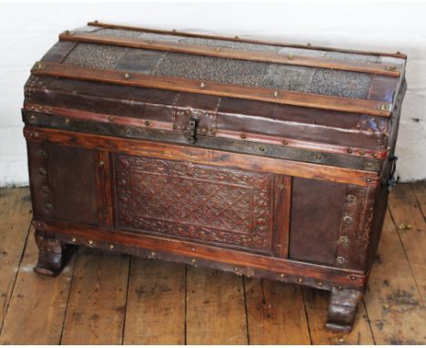 An 18th century Baroque style embossed leather studded chest, 53cm H x 80cm W x 43cm W with an early 20th century dome top tr