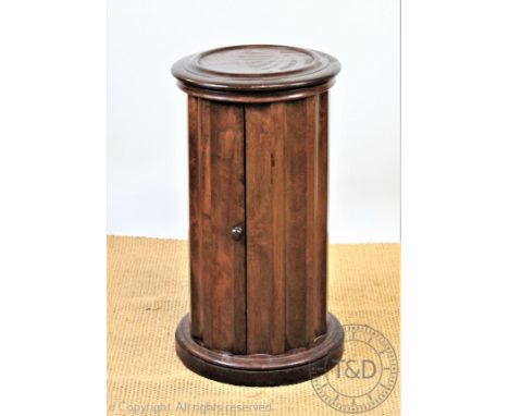 A late Victorian walnut cylindrical wash pot cupboard, with hinged lid enclosing a ceramic wash basin, 72cm H, with two 19th 