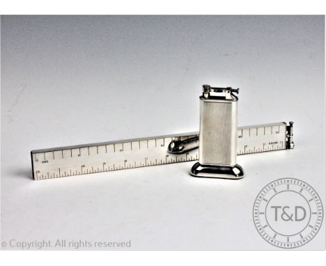 A Dunhill novelty silver plated table lighter modelled as a ruler, 32.5cm (lacking cover to the bottom), with a smaller Dunhi