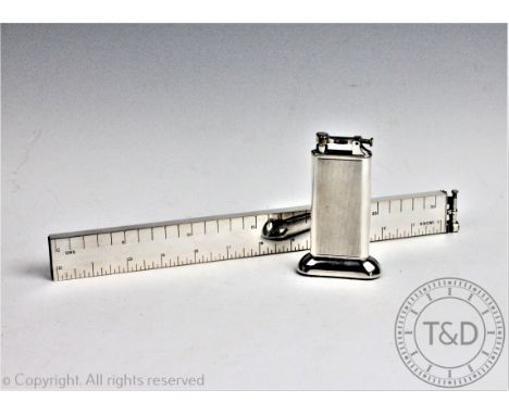 A Dunhill novelty silver plated table lighter modelled as a ruler, 32.5cm (lacking cover to the bottom), with a smaller Dunhi