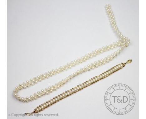 An untested pearl and gold coloured bead bracelet, with attached 14k gold clasp, 18.5cm long and an untested pearl 'tie' type