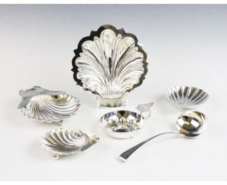 A collection of silver, to include; a near pair of silver shell shaped salts, 9.5cm long, two further shell shaped larger exa