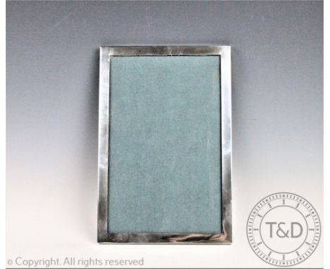 A large silver rectangular photograph frame, Rotherham &amp; Sons, Birmingham 1900, of plain polished form, lacking easel bac