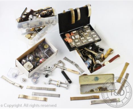 A large quantity of professional watchmakers tools and equipment, to include; numerous boxes of watch parts, boxes of dials, 