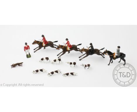 A Britains Ltd lead painted hunting group of two huntsman on horseback, two hunts woman side saddle, a huntsman standing and 