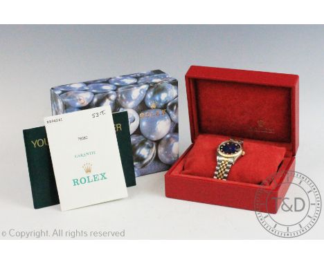 A Rolex Oyster Perpetual Datejust wristwatch, the circular dial enclosing graduated blue face with diamond dot dial, subsidia