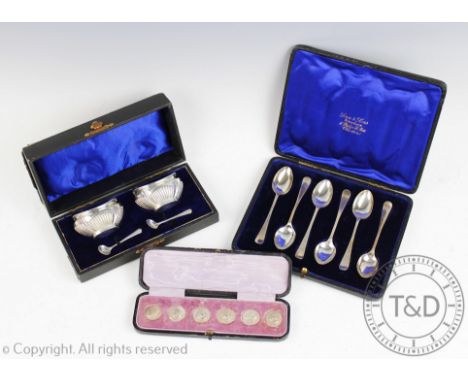 A cased set of six silver buttons Levi and Salaman, Birmingham 1900, each depicting a classical warrior, with a cased set of 