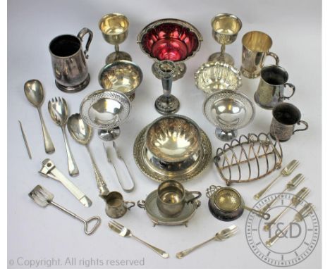 Assorted silver plate to include; a pair of miniature tazza's, a swing handled sugar basket with red glass liner, toast rack,
