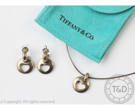 A Tiffany & Co sterling silver heart necklace and matching earrings c.1999, each designed as a circular panel with cut-out he