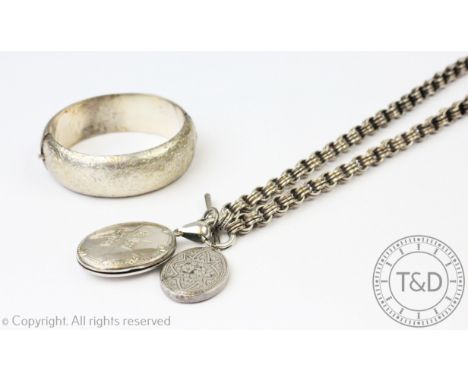 A Victorian locket and further pendant attached to a collarette necklace, unmarked, along with a hinged bangle also unmarked 