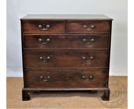 A George III oak chest, of two short and three long drawers, on bracket feet, 90cm H x 94cm W x 50cm D CONDITION REPORT: The 
