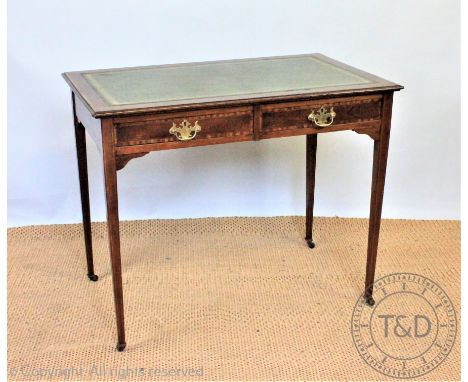 An Edwardian inlaid mahogany writing table, with two drawers, on tapered legs, 74cm H x 91.5cm W x 55cm D CONDITION REPORT: T