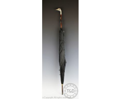 A Victorian silver mounted ostrich parasol, Julius Klinkhardt, London 1892, the handle formed as a birds mask set with glass 