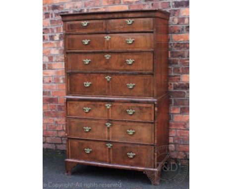 A George III and later oak and walnut chest on chest, with moulded cornice above two short and three graduated long drawers, 