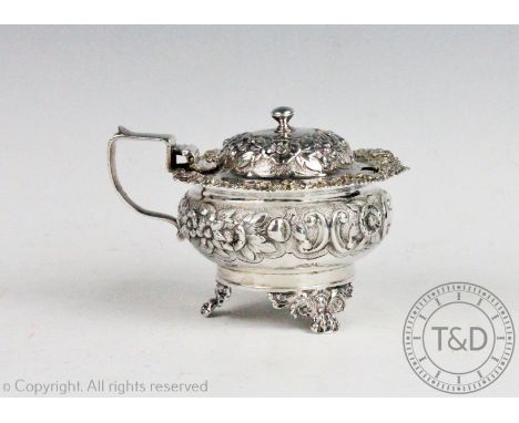A William IV silver wet mustard, Abstinando King, London 1823, of compressed circular form, with hinged cover, profusely deco