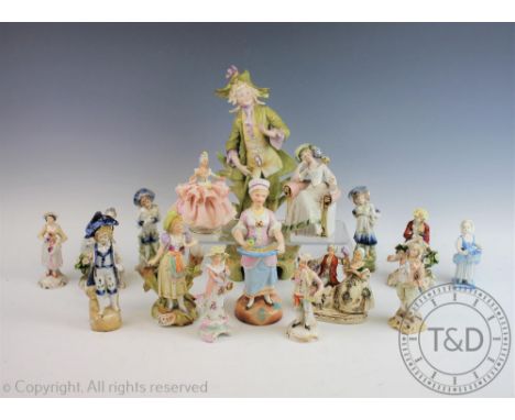 A collection of Austrian porcelain figures including Sitzendorf examples, allegorical examples adn further bisque figural gro