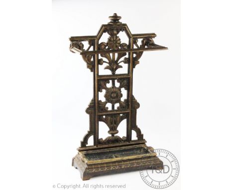 A Coalbrookdale cast iron umbrella stand, late 19th century, the back cast and pierced with flowers and leaves above a remove