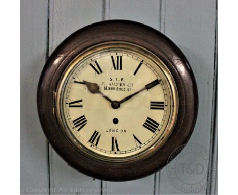 A reproduction circular wall clock named 'S.I.R JNo Walker Ltd, 63 New Bond Street, London', within a stained case enclosing 