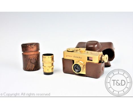 A Riken Golden Steky subminiature camera with attached Riken Stekinar 1:3.5 f=2.5cm lens and spare Ricoh F=40mm lens, each ca