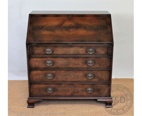 A reproduction mahogany bureau, with fall enclosing a fitted interior, over four graduated long drawers, on bracket feet, 101