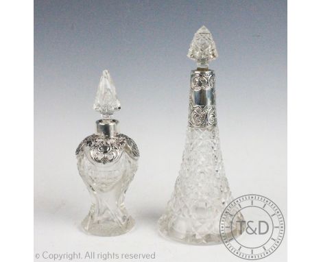 An Edwardian silver mounted perfume bottle Levi and Salaman, Birmingham 1907, of high shouldered form, 17cm high and a silver