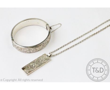 A silver ingot pendant, London 1977, with an attached Belcher link chain with bolt ring clasp stamped 'Sterling', and a silve