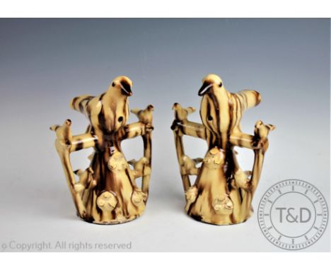 A pair of 18th century style Halifax bird whistles, each conical shaped trunk surmounted with a bird and four further smaller