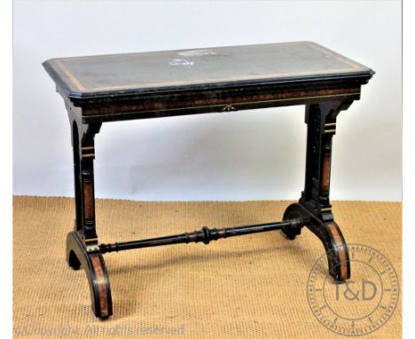 A 19th century Aesthetic ebonised and amboyna card table by Ogden of Manchester, with folding top enclosing a baize lined int