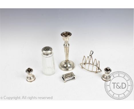 A George V silver four division toast rack, Levesley Brothers, Sheffield 1916, of navette shape with shaped handle, 10cm long