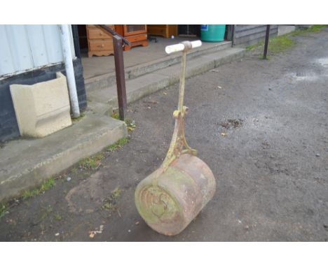 A cast iron garden roller