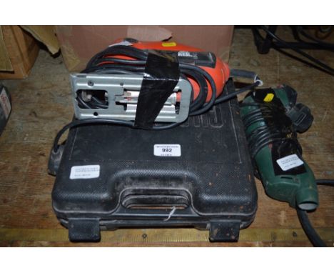 A Black &amp; Decker jigsaw together with a Bosch Orbit sander and a Challenge jigsaw in case 