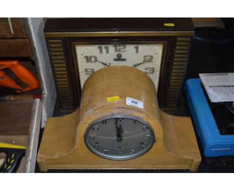 A three hole mantel clock together with a sunrise wall clock