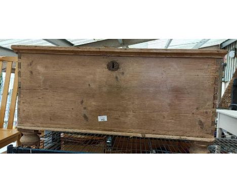 Large 19th century pine trunk on bun feet
