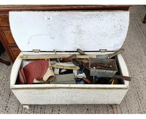Large collection of hand tools in a wicker basket