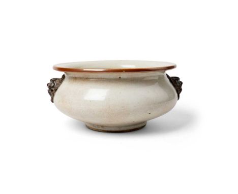 GE-TYPE CRACKLE-GLAZED LION-HEAD CENSER QING DYNASTY, 18TH CENTURY 清 仿哥釉雙獅耳香爐 of compressed globular form, supported on a sho