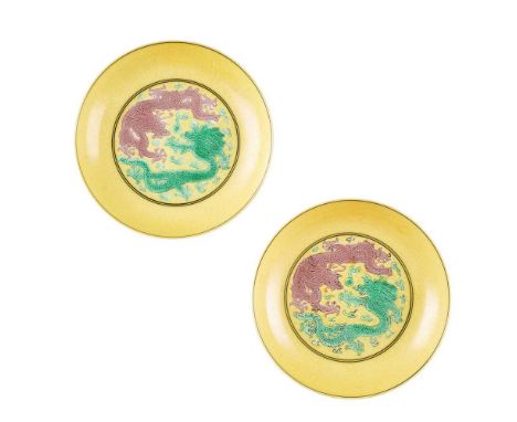 PAIR OF YELLOW-GROUND AUBERGINE AND GREEN-ENAMELLED 'DRAGON' DISHES GUANGXU MARK AND POSSIBLY OF THE PERIOD  光緒款或到代 黃地紫綠彩雙龍戲珠