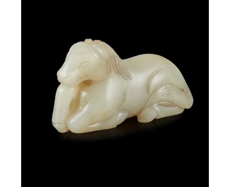 CELADON JADE CARVING OF A RECLINING HORSE MING DYNASTY OR LATER  明或更晚 青玉雕臥馬 in the recumbent pose, with legs tucked underneat