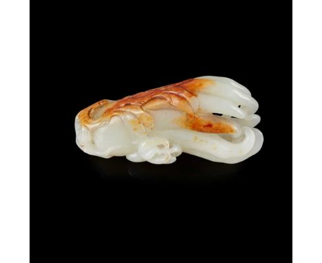 WHITE JADE WITH RUSSET SKIN CARVING OF FINGER CITRUS QING DYNASTY, 19TH CENTURY 清 白玉帶皮雕佛手擺件 realistically carved with one lar