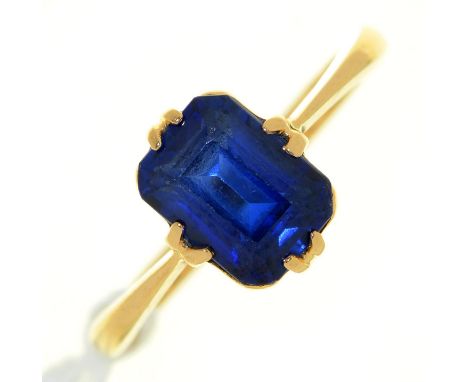 A step cut synthetic sapphire ring, in gold marked 18ct, 3.2g, size L 