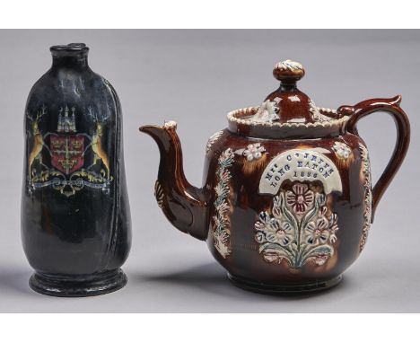 A barge ware teapot, 1886, with polychrome floral sprigs and impressed on a banner in printer's type Mrs C JEFFS LONG EATON 1