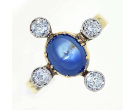 A sapphire and diamond cruciform ring, with larger central cabochon sapphire, in gold, 4.2g, size K Good condition, the colle
