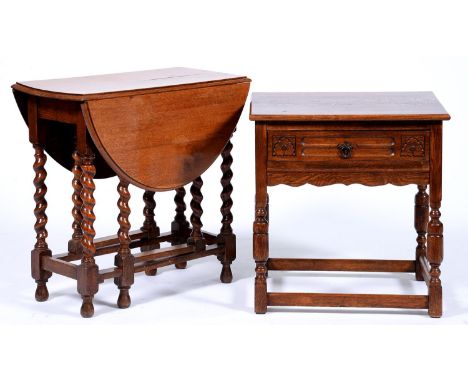 An oak side table, the leaf carved drawer with iron ring handle, on turned legs united by stretchers, 63cm l and an oak gatel