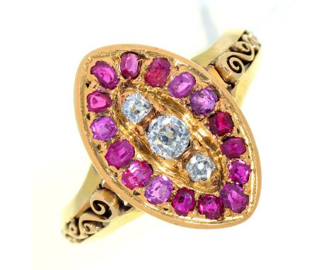 A ruby and diamond navette cluster ring, in gold with scroll pierced shoulders, 6g, size O½ Good condition