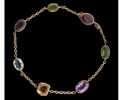A gold bracelet, early 20th c, with shield shaped and oval coloured pastes at intervals, 25cm, unmarked, 8.9g Light wear scra