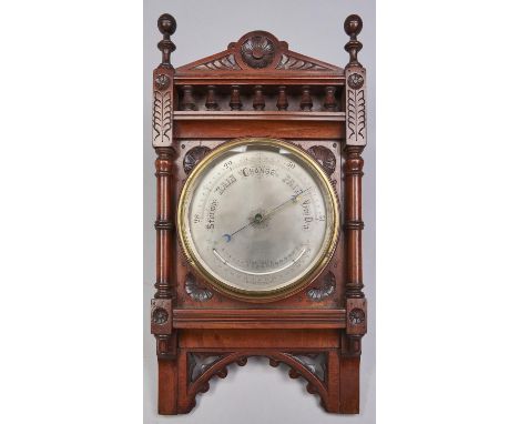 A Victorian walnut aneroid wall barometer, c1870, with silvered register and mercury thermometer, 57.5cm h Good condition. Ba