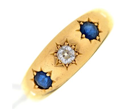 A sapphire and diamond ring, gypsy set in gold marked 18ct, 5.3g, size R Sapphires slightly scratched when examined under 10x