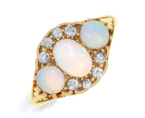 An opal and diamond ring, in 18ct gold, Chester 1938, 4.4g, size K½ Opals with dull polish scratched from wear