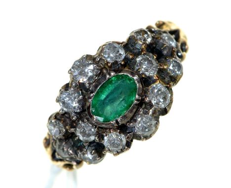 An emerald and diamond ring, 19th c, gold hoop with chased, bifurcated shoulders, 4.6g, size N Several of the mixed cut diamo