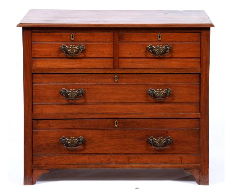 An Edwardian walnut chest of drawers, the rectangular top with moulded lip above two short over two long drawers, all with ho
